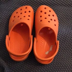 CROCS Women’s Size extra Small. Rubber Orange